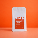Honduras COMSA koffiebonen van SIJL in een witte zak met oranje label