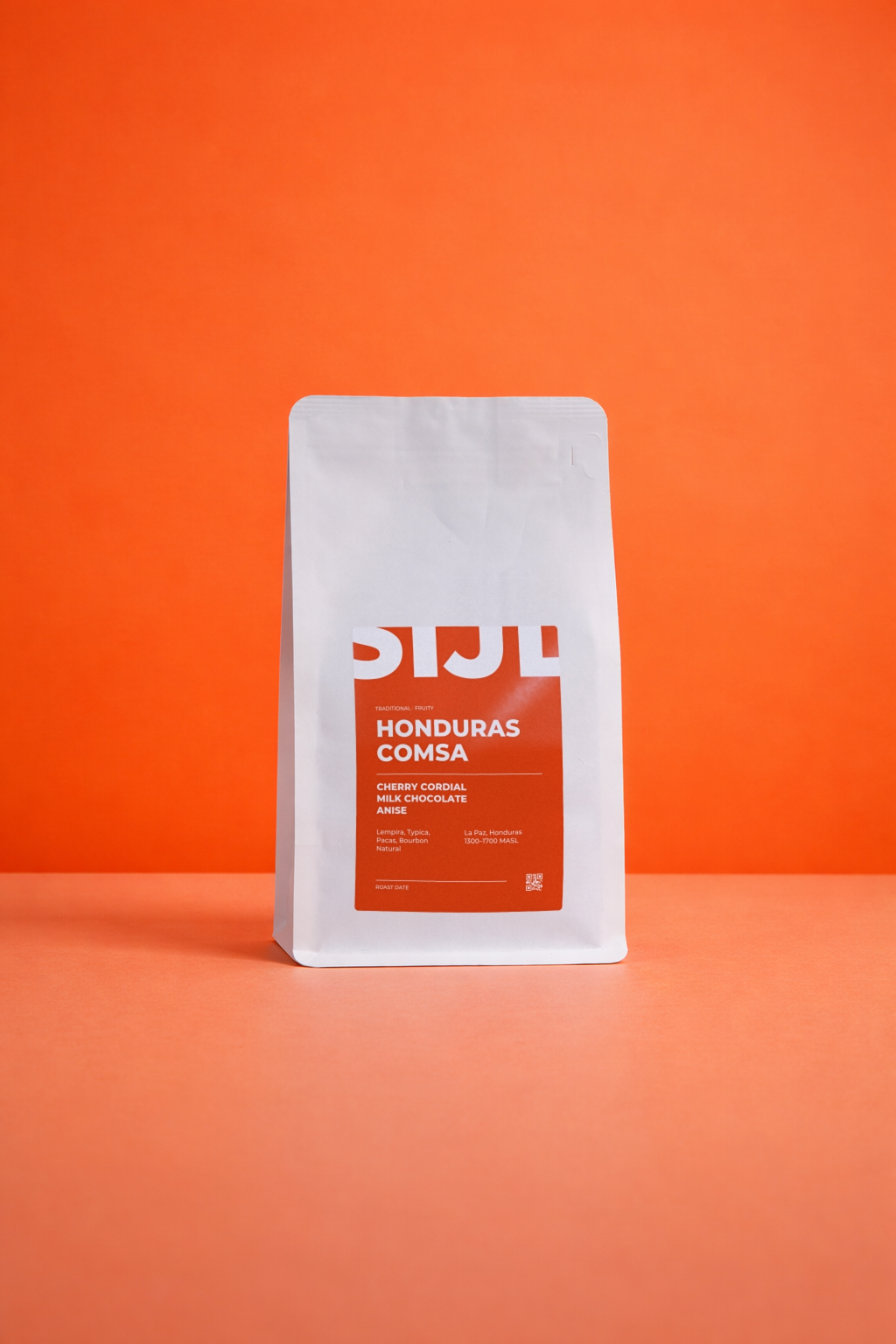 Honduras COMSA koffiebonen van SIJL in een witte zak met oranje label